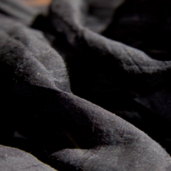 Tangled dark threads on light surface